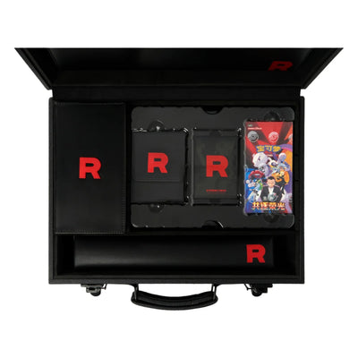Open Pokémon TCG Chasing Glory Together / Destined Rivals Team Rocket briefcase showing the included accessories and booster box on white.